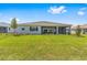 The home has a well-maintained backyard and a screened-in covered patio at 10026 Sw 85Th Place Rd, Ocala, FL 34481