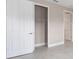Neutral bedroom featuring a closet with white doors and a wire rack for organized storage at 10026 Sw 85Th Place Rd, Ocala, FL 34481