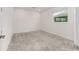 Minimalist bedroom featuring a window with neutral color palette and natural light at 10026 Sw 85Th Place Rd, Ocala, FL 34481