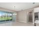 Sunlit dining area with sliding glass doors and elegant chandelier at 10026 Sw 85Th Place Rd, Ocala, FL 34481