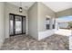 Covered entrance featuring a decorative front door, patterned tile and bright natural light at 10026 Sw 85Th Place Rd, Ocala, FL 34481