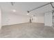 Spacious and well-lit garage, equipped with overhead door and offering ample parking and storage at 10026 Sw 85Th Place Rd, Ocala, FL 34481