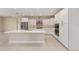 Well-equipped kitchen features stainless steel appliances, white cabinets, and an island at 10026 Sw 85Th Place Rd, Ocala, FL 34481