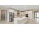 New kitchen features stainless steel appliances, center island, and ample storage at 10026 Sw 85Th Place Rd, Ocala, FL 34481