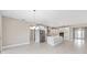 Bright, open kitchen boasts stainless steel appliances, white cabinets, and a large island at 10026 Sw 85Th Place Rd, Ocala, FL 34481