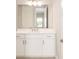 Bathroom with white vanity and a large mirror at 10045 Sw 82Nd Place Rd, Ocala, FL 34481