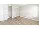Neutral bedroom featuring a walk-in closet and wood-look floors at 10045 Sw 82Nd Place Rd, Ocala, FL 34481