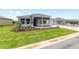 Charming home featuring a well-manicured lawn, lush landscaping, and ample parking at 10045 Sw 82Nd Place Rd, Ocala, FL 34481