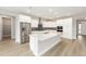 Modern kitchen featuring white cabinetry, stainless steel appliances and an island at 10045 Sw 82Nd Place Rd, Ocala, FL 34481