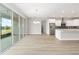 Open floor plan with sliding glass doors near the kitchen space at 10045 Sw 82Nd Place Rd, Ocala, FL 34481