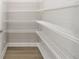 Walk-in pantry with multiple rows of wire shelving to maximize storage and organization at 10045 Sw 82Nd Place Rd, Ocala, FL 34481