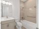 Modern bathroom featuring a tiled shower and vanity sink at 10561 Sw 98Th Pl, Ocala, FL 34481