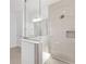 Modern bathroom featuring a tiled shower with a glass partition and built-in niche at 10561 Sw 98Th Pl, Ocala, FL 34481