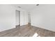 Empty room featuring wood-look floors and a closet with double doors at 10561 Sw 98Th Pl, Ocala, FL 34481