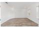 Spacious bedroom with recessed lighting, a window, and wood-look flooring at 10561 Sw 98Th Pl, Ocala, FL 34481