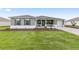 Well-maintained single-story home features a lush lawn and a convenient two-car garage at 10561 Sw 98Th Pl, Ocala, FL 34481