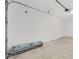 Spacious garage with a concrete floor and a white cinderblock wall at 10561 Sw 98Th Pl, Ocala, FL 34481