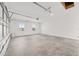 Spacious garage with a concrete floor and two windows for natural light at 10561 Sw 98Th Pl, Ocala, FL 34481