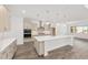 Modern kitchen with a large center island, stainless steel appliances, and ample cabinetry at 10561 Sw 98Th Pl, Ocala, FL 34481