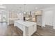 Contemporary kitchen with pendant lights, stainless steel appliances, and a large center island at 10561 Sw 98Th Pl, Ocala, FL 34481