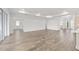 Large living space with tray ceiling, recessed lighting, and an open layout, perfect for entertaining at 10561 Sw 98Th Pl, Ocala, FL 34481