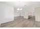 Open-concept space with a kitchen island, dining area, and living room, perfect for modern living at 10561 Sw 98Th Pl, Ocala, FL 34481