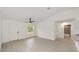 Bright living space with wood-look floors leading to a kitchen, bathroom and bedroom areas at 1083 Sw Winding Hills Rd, Dunnellon, FL 34431