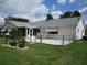 The backyard has a well-maintained lawn with seating and a chain link fence at 11470 Sw 139Th St, Dunnellon, FL 34432