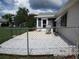 Open backyard patio space with grill and seating, enclosed by chain-link fence at 11470 Sw 139Th St, Dunnellon, FL 34432