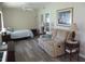 Bright bedroom offering a comfortable sitting area and a calming aesthetic enhanced by the natural light at 11470 Sw 139Th St, Dunnellon, FL 34432