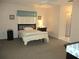 Well-lit bedroom featuring neutral colors, carpet flooring, and natural light from the window at 11470 Sw 139Th St, Dunnellon, FL 34432
