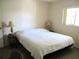 Bedroom featuring natural light, neutral tones, and a view of a ceiling fan at 11470 Sw 139Th St, Dunnellon, FL 34432