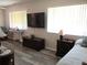 Inviting bedroom filled with natural light, showcasing hardwood floors and a relaxing ambiance at 11470 Sw 139Th St, Dunnellon, FL 34432