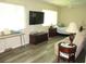 Bright bedroom offering a comfortable sitting area and a calming aesthetic enhanced by the natural light at 11470 Sw 139Th St, Dunnellon, FL 34432