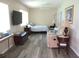 Bright bedroom offering a comfortable sitting area and a calming aesthetic enhanced by the natural light at 11470 Sw 139Th St, Dunnellon, FL 34432