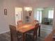 Dining room featuring wood floors, neutral walls, and a chandelier at 11470 Sw 139Th St, Dunnellon, FL 34432