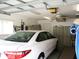 This garage has ample storage space, ceiling fan, and is ready to house your vehicle at 11470 Sw 139Th St, Dunnellon, FL 34432