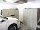 The garage features a vehicle and lots of cabinet storage at 11470 Sw 139Th St, Dunnellon, FL 34432