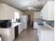 Bright kitchen with white cabinetry, backsplash, and modern appliances providing ample counter space at 11470 Sw 139Th St, Dunnellon, FL 34432