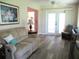 Inviting living room with French doors and comfortable seating enhanced by the natural light at 11470 Sw 139Th St, Dunnellon, FL 34432