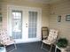 Screened patio with sliding glass doors, furniture and a view of the yard at 11470 Sw 139Th St, Dunnellon, FL 34432