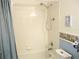 Shower with a standard shower head, a soap dish, and a curtain at 11470 Sw 139Th St, Dunnellon, FL 34432