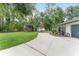Spacious backyard with carport, shed, and well-maintained landscaping at 12681 Se 54Th Ave, Belleview, FL 34420
