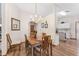 Cozy dining room features hardwood floors, chandelier and decorative mirror at 12681 Se 54Th Ave, Belleview, FL 34420
