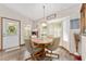 Cozy dining area features a round table, comfortable chairs, and bay window, creating a welcoming space at 12681 Se 54Th Ave, Belleview, FL 34420