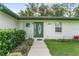 Close-up of the front door highlighting the address and decorative glass at 12681 Se 54Th Ave, Belleview, FL 34420