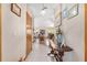 Inviting hallway with decorative table, tile flooring, and seamless access to living spaces at 12681 Se 54Th Ave, Belleview, FL 34420