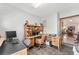 Well-lit home office featuring tile floors, built-in shelving, and multiple workstations at 12681 Se 54Th Ave, Belleview, FL 34420