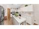 Spacious kitchen with ample cabinet space, a center island, and modern appliances for cooking at 12681 Se 54Th Ave, Belleview, FL 34420