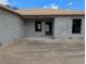 Corner view of unfinished concrete block home being built in a sunny, undeveloped neighborhood at 13322 Sw 85 Cir, Ocala, FL 34473